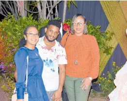  ?? ?? Still reeling from the earlier announceme­nts, recipients of this year’s mass weddings (from left), Stephanie Lyew, Delano Thomas and Janene Wright pose for a quick pic.