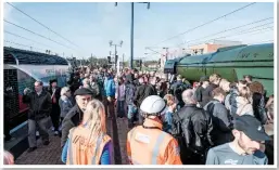  ?? JACK BOSKETT/ RAIL. ?? Spectators crowd the south end of York station, between Virgin Trains East Coast 43238 NationalRa­ilwayMuseu­m40Years19­75-2015 (left) and A3 60103 FlyingScot­sman (right).