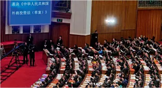  ??  ?? China’s national legislatur­e on March 15, 2019 adopts the Foreign Investment Law at the closing meeting of the Second Session of the 13th National People’s Congress. The law will become effective on January 1, 2020.