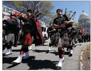  ?? Arkansas Democrat-Gazette/THOMAS METTHE ?? Bagpipers march past firetrucks during the opening of the Arkansas Fallen Firefighte­rs Memorial Service on Saturday in Little Rock.