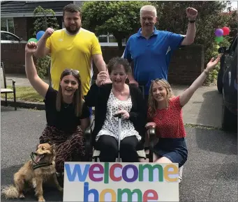  ??  ?? Stephen, John, Emma, Lisa (and Baz the dog) all welcome Medical Miracle Laura back home!