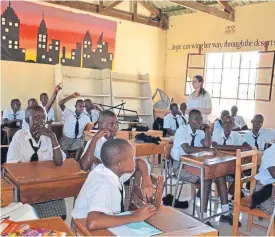  ??  ?? Jennifer MacDonald teaches to her pupils in the WISER Girls School, Kenya