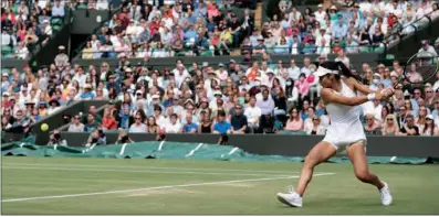  ??  ?? Britain’s Emma Raducanu returns against Romania’s Sorana Cirstea during their women’s singles third round match at the 2021 Wimbledon Championsh­ips at The All England Tennis Club in London on Saturday. Raducanu won 6-3, 7-5.