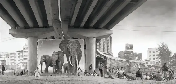  ?? Photos by Nick Brandt / Fahey/Klein Gallery, Los Angeles ?? “Underpass With Elephants (Lean Back, Your Life Is on Track)” is one of 13 prints in “Inherit the Dust,” on view in 5foottall panoramas.