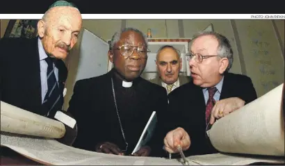  ?? PHOTO: JOHN RIFKIN PHOTO: JOHN RIFKIN ?? Sir Sigmund gives Cardinal Arinze of Nigeria his first view of a Sefer, with Willie Kessler and Tony Bayfield in 2002