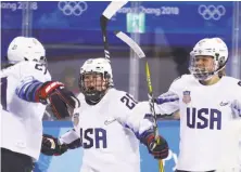  ?? Bruce Bennett / Getty Images ?? Kendall Coyne (center) celebrates after scoring the go-ahead goal against Finland in the Americans’ Olympic opener.