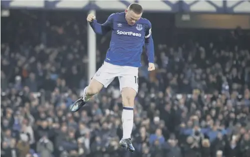  ?? PICTURE: CLIVE BRUNSKILL/GETTY ?? 0 Wayne Rooney celebrates after scoring from the penalty spot to put Everton 3-1 ahead .
