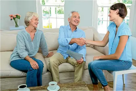  ?? PHOTO: 123RF ?? A handshake on a loan from one generation to another. These days it may well be the daughter lending money to mum and dad.