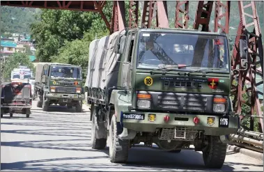  ?? ANI ?? Army vehicles leaving for Leh with military contingent­s for troops deployed in Ladakh, on the Manali-leh route during the ongoing dispute at the India-china Line of Actual Control, in Kullu on Thursday.