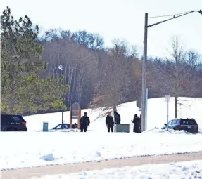  ?? ABBIE PARR/AP ?? Law enforcemen­t officers respond to a scene where two police officers and a first responder were shot and killed Sunday in Burnsville, Minn.