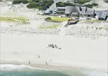  ?? Andrew Mills NJ Advance Media ?? NEW JERSEY Gov. Chris Christie and his family and friends use the beach at the governor’s summer house at Island Beach State Park on Sunday. “It’s just the way it goes,” the governor responded to his critics.