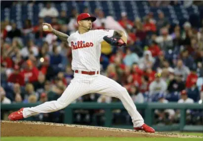  ?? MATT SLOCUM — THE ASSOCIATED PRESS ?? Phillies pitcher Vince Velasquez firing during the third inning Tuesday night against the Braves. It was a bit of a mixed-bag night for Velasquez, but he pitched well enough to win. His team’s defense didn’t allow it, though.