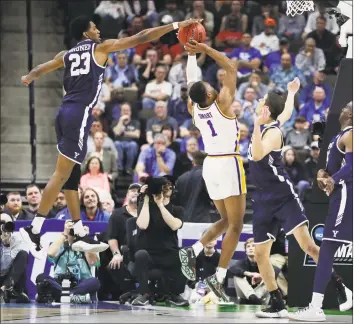  ?? John Raoux / Associated Press ?? Yale forward Jordan Bruner (23) blocks a shot attempt by LSU’s Javonte Smart (1) during the second half on Thursday.