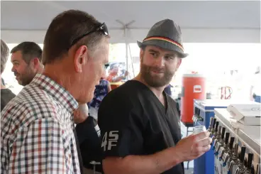  ?? Staff photo by Junius Stone ?? ■ Local craft brewing experts introduce Texarkana beer enthusiast­s to the joys of home brewing in their first appearance at Texarkana’s Dine on the Line, this year with an Oktoberfes­t connection.