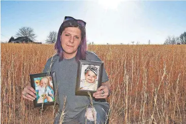  ?? [AP ?? Sarah Sherbert poses for a photo Feb. 5 in Anderson, S.C., holding photos of her children when they were infants. The two babies, born 15 months apart when she was overcoming opioid addiction, got two very different treatments at two different South...