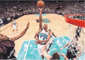  ?? GERRY KAHRMANN ■ PNG ?? Vancouver Grizzlies’ Shareef Abdur-rahim scores a basket during a 1999 NBA game againist the Utah Jazz at GM Place in Vancouver.