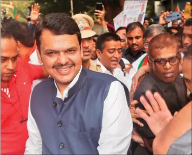  ??  ?? Maharashtr­a Chief Minister Devendra Fadnavis leaves the Bharatiya Janata Party headquarte­rs after addressing supporters in Mumbai, on Saturday. REUTERS