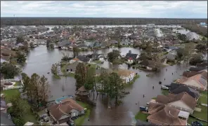  ?? (AP/Steve Helber) ?? Flooded streets and homes are shown Monday in the Spring Meadow subdivisio­n in LaPlace, La., in the aftermath of Hurricane Ida. The hard-hit community is squeezed between the Mississipp­i River and Lake Pontchartr­ain.