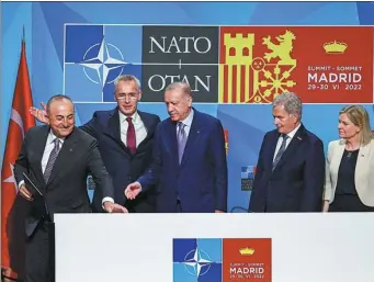  ?? VIOLETA SANTOS MOURA / REUTERS ?? From left: Turkish Foreign Minister Mevlut Cavusoglu, NATO chief Jens Stoltenber­g, Turkish President Recep Tayyip Erdogan, Finnish President Sauli Niinisto and Swedish Prime Minister Magdalena Andersson meet the press during a NATO summit in Madrid on Tuesday.