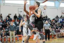  ?? MIKEY REEVES — FOR DIGITAL FIRST MEDIA ?? Garnet Valley’s Austin Laughlin goes up for a shot in the fourth quarter against Lower Merion Sunday in the Central League semifinals at Marple Newtown. Lower Merion won, 72-59.