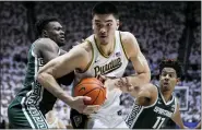  ?? MICHAEL CONROY — THE ASSOCIATED PRESS ?? Purdue center Zach Edey (15) moves to the basket between Michigan State center Mady Sissoko (22) and guard A.J. Hoggard (11)during the game in West Lafayette, Ind., Jan. 29.