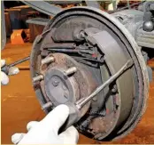 ??  ??  When you’re ready to refit the
15
brake drum, make sure the brake shoes are centralise­d using a couple of screwdrive­rs, as shown here. Manoeuvre the drum on, then adjust the shoes (if they can be adjusted) until the drum locks, then back-off the adjuster by a quarter of a turn. Take up the slack in the handbrake cable.