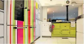  ??  ?? Earning their stripes: the Rogan family and their circus-coloured kitchen