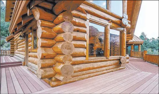  ?? Berkshire Hathaway Home Services ?? This Mount Charleston Douglas fir log home is listed for $1.75 million. It measures 4,466 square feet and has a deck.