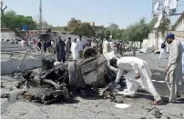  ?? AFP ?? Security officials inspect the site of the explosion that targeted a police vehicle in Quetta on Friday. —