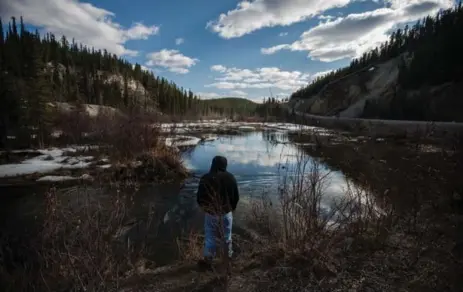  ??  ?? GABRIEL SMARCH stands by the McIntyre Creek on the outskirts of Whitehorse, a place where he feels calm. He said “J.V.” began abusing him at an early age. “I’ve yelled for help so many times and nobody heard it. Not the cops, not my social workers, not...