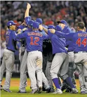  ?? GETTY IMAGES ?? The Cubs celebrate after beating the Indians 8-7 in 10 innings in Game 7 of the 2016 World Series.