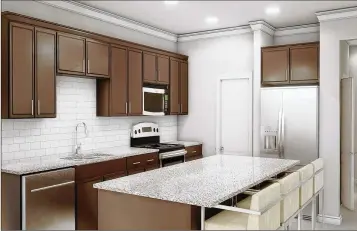  ??  ?? The open concept plans include large kitchen islands with standard luxury features such as granite countertop­s.