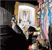  ?? ANTONIO PEREZ/CHICAGO TRIBUNE ?? Pilgrims representi­ng parishes throughout Cook and Lake counties brave the cold weather in 2013 to view the image of Our Lady of Guadalupe during the annual pilgrimage, Mass and celebratio­n in her honor in Des Plaines.