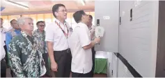  ??  ?? Pau (second right) and others inspecting the storage cupboards and other basic school essentials in the school hostel.