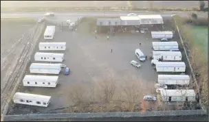  ??  ?? ■ A yard illegally converted to a caravan site has been closed after drugs and a stun gun were found with children living in “horrific conditions”.