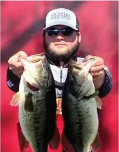  ?? (Special to The Commercial/UAM College of Forestry, Agricultur­e and Natural Resources) ?? McCoy Vereen hoists two bass caught during the Arkansas State Collegiate Championsh­ip.