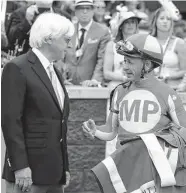  ?? Gregory Payan / Associated Press ?? Because he is serving a suspension, Bob Baffert, left, turned over the training of two Derby horses.