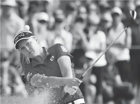  ?? PHOTOS: JONATHAN HAYWARD/THE CANADIAN PRESS ?? Brooke Henderson is tied for second heading into Saturday at the CP Women’s Open in Regina.