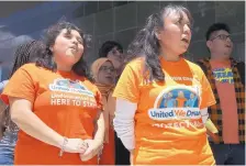  ?? YI-CHIN LEE/HOUSTON CHRONICLE ?? DACA recipients Indira Nicole Marquez Robles, 18, left, Damaris Gonzalez, 34 and United We Dream allies chant “Here to Stay” after a Wednesday court hearing in Houston challengin­g DACA.