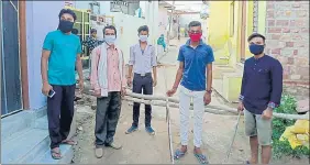  ?? HT PHOTO ?? Youths guard an entry point at Kaithri village in Dholpur district.