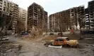  ?? Photograph: Alexander Ermochenko/ Reuters ?? Shelled buildings in the besieged southern port city of Mariupol, Ukraine, March 2022.