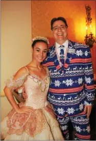  ??  ?? Ballerina Leah Farro and the company’s executive director David Gray head off to the Academy of Music for the afternoon performanc­e of the Nutcracker Suite.