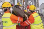  ?? LUAN QINCHENG/XINHUA ?? Rescuers carry a miner who was trapped in a gold mine in Qixia City in east China’s Shandong province Sunday.