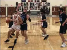  ?? ANDREW ROBINSON/MEDIANEWS GROUP ?? Upper Dublin’s Drew Stover (42) powers in against the defense of Josh Jones (24) and North Penn on Monday.