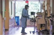  ?? JOE RONDONE/ THE COMMERCIAL APPEAL VIA AP ?? Doctors and nurses wear full-protective masks and face shields as they work on COVID-19 positive patients in May at Baptist Memorial Hospital-Memphis in Memphis.