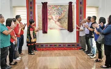  ?? PHOTOGRAPH COURTESY OF COCA COLA ?? WOMEN’S economic empowermen­t was celebrated in Tagum City. Coca-Cola Philippine­s commission­ed and unveiled the Empowered Woman artwork displayed at the Tagum City Historical and Cultural Center.