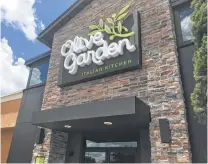  ?? Kyle Arnold / Orlando Sentinel ?? Darden, the parent of Orlando-based Olive Garden, has posted 11 straight quarters of same-restaurant sales growth. Its stock has climbed to an all-time high.