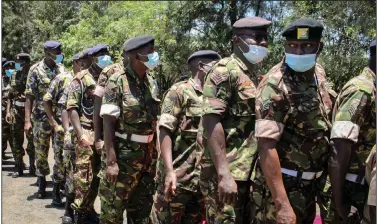  ?? (AP) ?? Kenya Defense Forces soldiers line up to get the coronaviru­s vaccine Thursday at the Kahawa Garrison near Nairobi. As Africa lags in its efforts to vaccinate its 1.3 billion people, the continent must develop the capacity to produce its own vaccines, Dr. John Nkengasong, the director of the Africa Centers for Disease Control and Prevention, said at a news briefing.