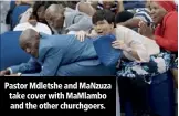  ??  ?? Pastor Mdletshe and MaNzuza take cover with MaMlambo and the other churchgoer­s.