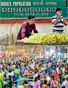  ?? ?? (Top) A fruits seller pushes his handcart in front of a population clock board in Mumbai. (Above) People walk in a market in Jalandhar. (AFP)